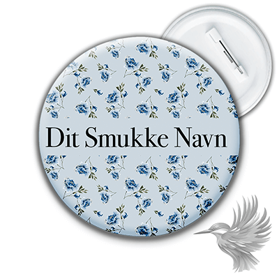 Personlige navne badges med blomstermønster og teksten 'Dit Smukke Navn' på en rund badge.
