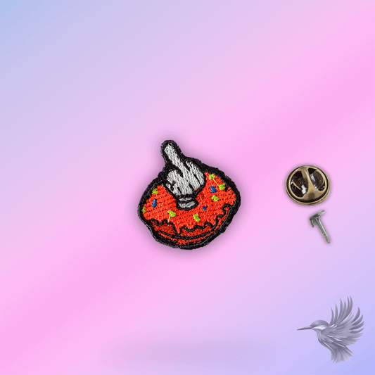 Donut pin featuring a colorful donut with a hand gesture, perfect for adding humor to clothing and caps.